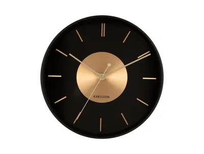 A black wall clock with a gold disc in the center and gold hour markers, presented on a white background.
