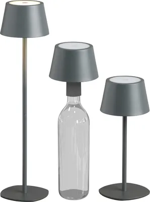 Three modern LED table lamps of varying heights, one of which is placed on a clear glass bottle.