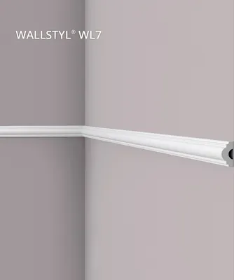A white decorative molding strip is installed in the corner of two walls.