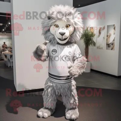 Produktbild von Maskottchen REDBROKOLY Kostümfigur Silberbändiger Löwe bekleidet mit einem langärmligen T-Shirt und Stirnbändern