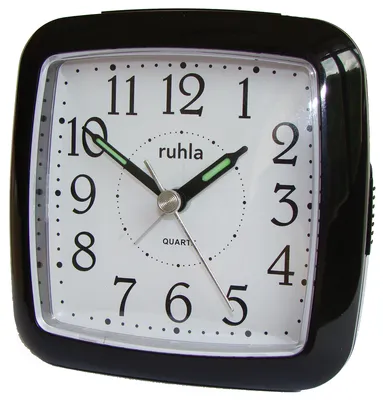 A black alarm clock with a white face and black numbers.