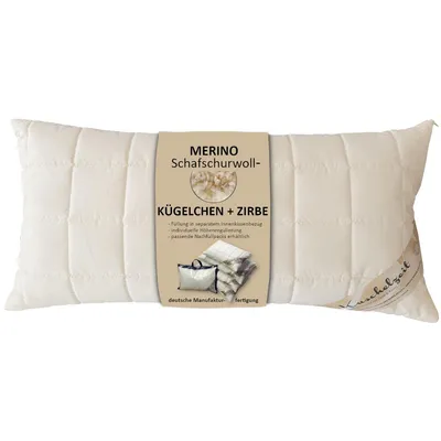 A cream-colored pillow with a product label attached.