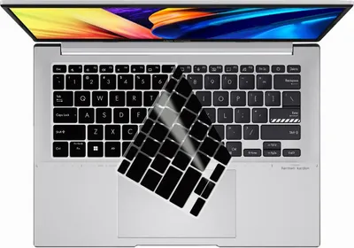 A top-down view of an open laptop with a keyboard cover partially covering the keyboard.