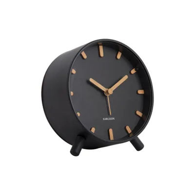 A black alarm clock with wooden accents and legs, shown from a side angle against a white background.