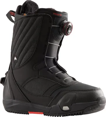 A black snowboard boot is shown against a white background.