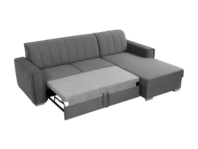 A gray sectional sofa with a pull-out bed mechanism extended.