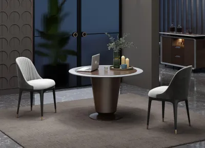 Image de Table à manger élégante de forme ronde – idéale pour les salles à manger stylées.