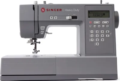 A gray Singer Heavy Duty sewing machine is shown against a white background.