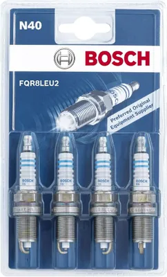 A package of four Bosch spark plugs.