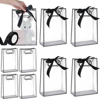 Produktbild von Durchsichtige, schwarze Geschenktüten, 15 Stück, 26 cm Länge, mit Öffnungen für Hochzeiten und Geburtstagsfeiern.