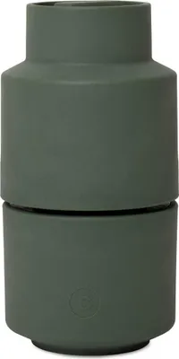 A dark green ceramic grinder.