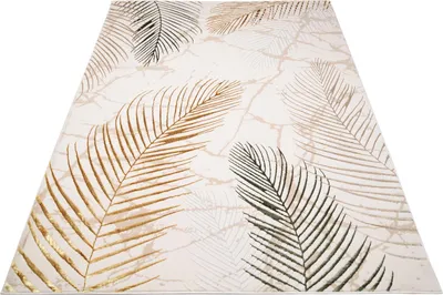 A rug with a leaf pattern is shown from a diagonal angle on a white background.