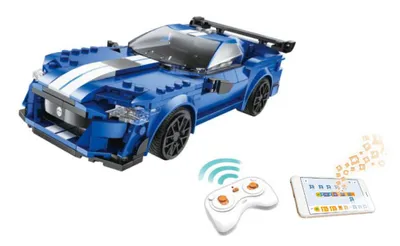 A blue remote-controlled toy car with white racing stripes, a remote control, and a tablet displaying programming blocks, all set against a white background.