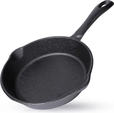 A black cast iron frying pan is shown against a white background.