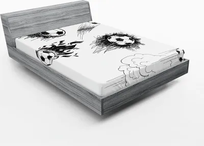 A fitted sheet with a black and white sketch pattern of soccer balls is shown on a bed frame.