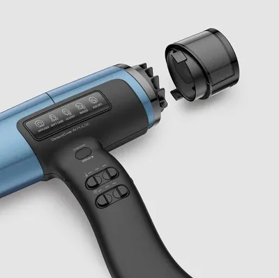 A close-up shot of a blue and black hair dryer with a detachable nozzle, against a light gray background.