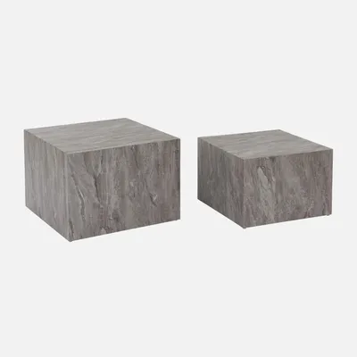 Two square coffee tables with a marble look, one larger than the other, are displayed against a white background.