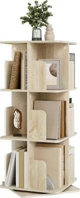 A rotating bookshelf with books and decorative items on a white background.