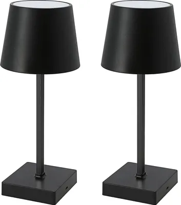 Two black table lamps with white tops are shown against a white background.