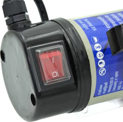 A close-up of a red rocker switch on a black housing, attached to a gray cylindrical device with a blue label.