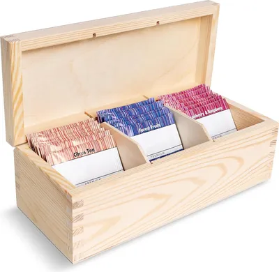 A wooden box with three compartments filled with tea bags.