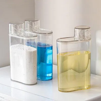 Produktbild von Flüssiger Waschmittelbehälter 1300 ml mit Maßschüssel – Durchsichtiger Waschmittelbehälter mit Fassungsanzeige
