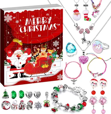 A Christmas advent calendar with various jewelry items displayed around it.
