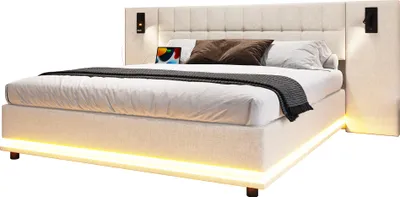 A modern upholstered bed with integrated lighting and bedside tables.