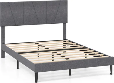 A gray upholstered bed frame with a slatted wooden base and a headboard with a geometric design, shown against a white background.