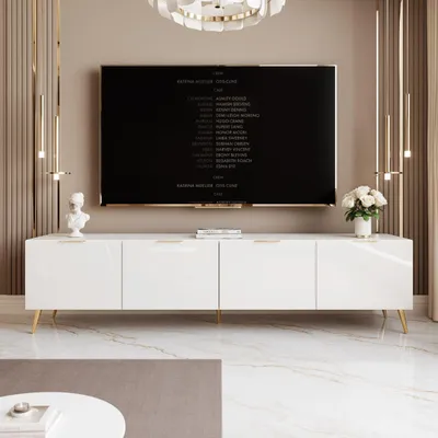 A modern living room with a white TV stand and a large television.