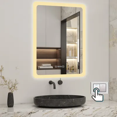 A modern bathroom with a sink and a lighted mirror.