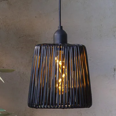 A black rattan-look pendant lamp with an exposed bulb.