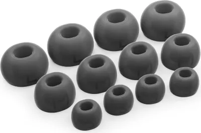A collection of black silicone ear tips for headphones, arranged in rows.
