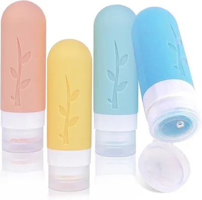 Produktbild von Famanu Reiseflaschen Set - 4 Stück - 90 ml - nachfüllbare Silikonflaschen mit Etikett und Reinigungsbürste