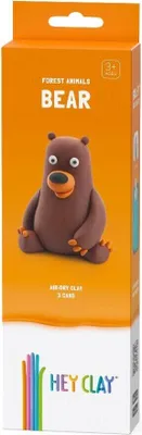 The image shows the front of a product box for a clay modeling kit. The box is orange and features a cartoonish brown bear made of clay. Text on the box indicates it is a 'Forest Animals Bear' kit and includes 'Air-Dry Clay'. The bottom of the box displays