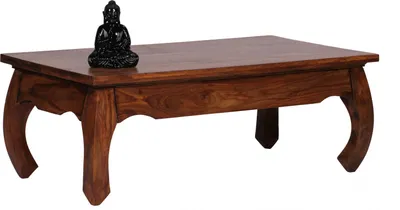 A dark brown wooden coffee table with a small black Buddha statue on top, set against a white background.