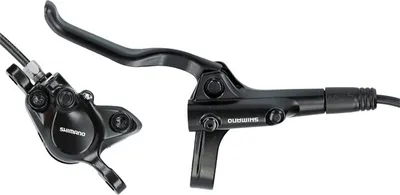 A black bicycle brake caliper and lever set against a white background.
