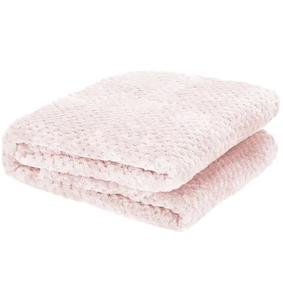 A folded pink blanket with a textured pattern.