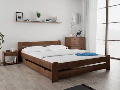 A bedroom scene with a wooden bed as the main focus.