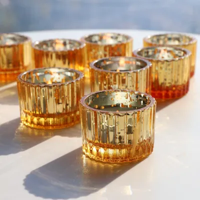 Produktbild von Set von 12 Teelichthaltern aus Glas in Gold