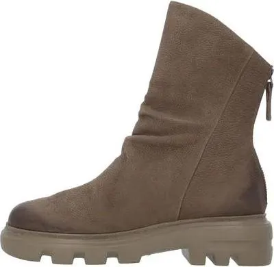 A side view of a single beige boot against a white background.