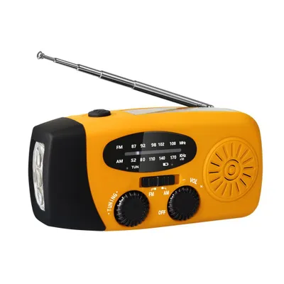 A bright orange and black emergency radio with a built-in flashlight and an extended antenna, set against a plain white background.