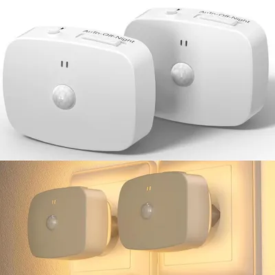 Two white LED night lights with motion sensors are shown in a studio setting and then plugged into wall outlets, emitting a warm glow.