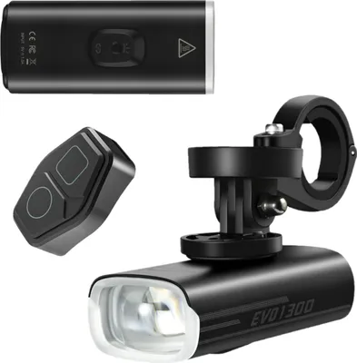 A product shot of a bicycle front light, its remote control, and a Garmin mount, all presented on a white background.