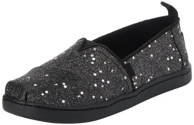 Immagine prodotto di Scarpe basse da bambina TOMS, modello Classic Alpargata, in tela con glitter neri effetto "cosmic"