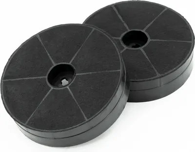Two round, black charcoal filters for a range hood.