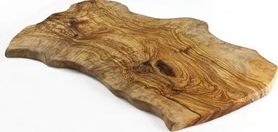 A wooden cutting board with a natural, irregular edge.