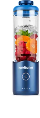 A blue Nutribullet portable blender filled with fruit and ice, shown against a white background.