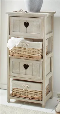 A narrow wooden chest of drawers with two drawers and two wicker baskets with fabric lining.