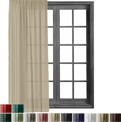 A sheer curtain hangs in front of a window with multiple panes.